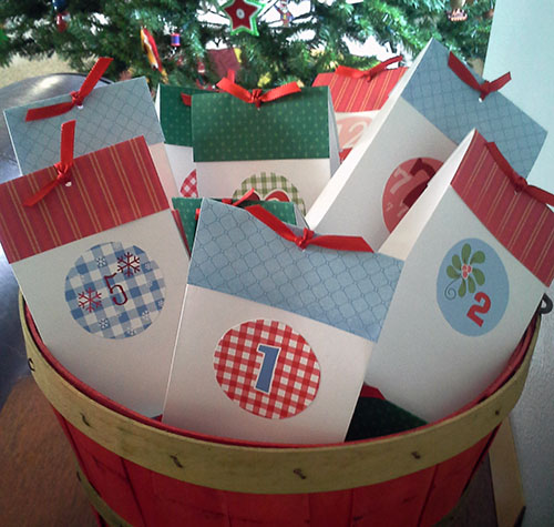 Envelopes in the red & green bushel basket that once held pine cones from Milwaukee with love.